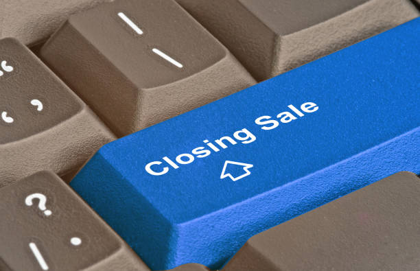istock Keyboards with key for closing sale 826176240