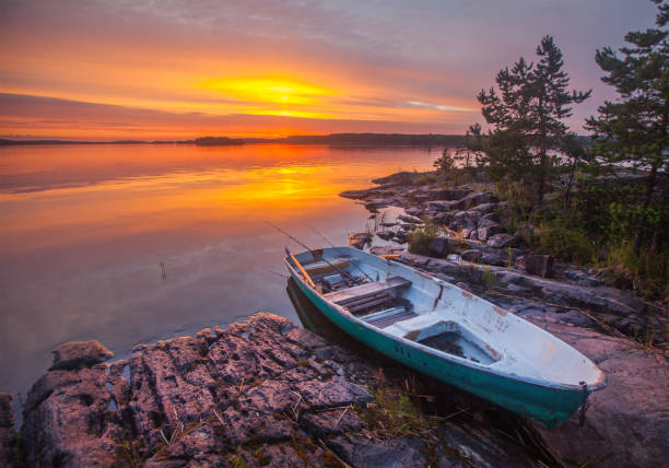 istock sunset and fishing boat 826177346
