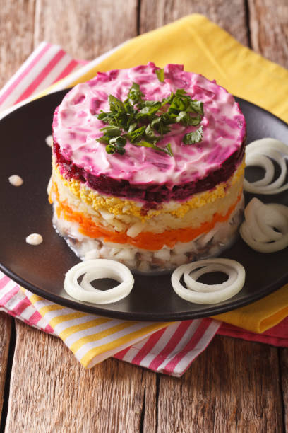 istock Russian food: Shuba - herring salad with vegetables close-up. vertical 826179270