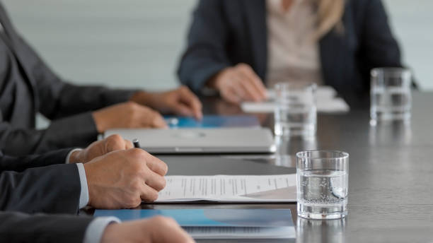 istock Hands of businessman signing document 826183500