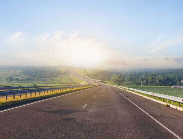 istock long asphalt road at the morning 826183932