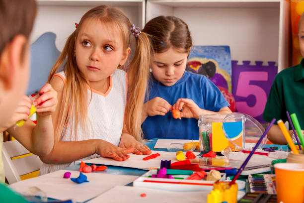 istock Child dough play in school. Plasticine for children. 826187058