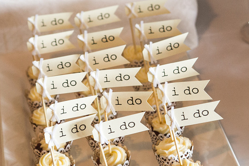 Row of 'I Do' wedding cupcakes