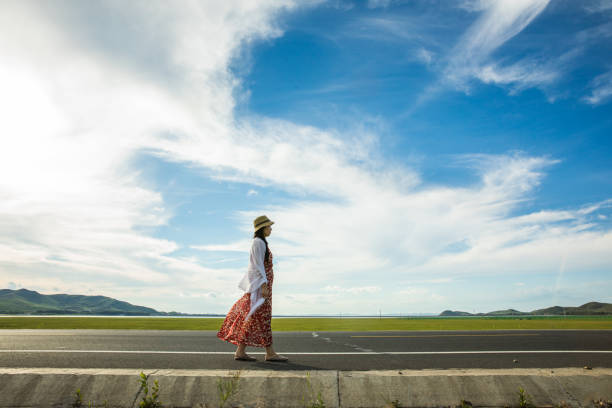 woman walking on road