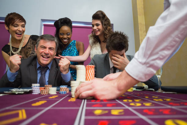 istock Man celebrating victory at roulette 826194288