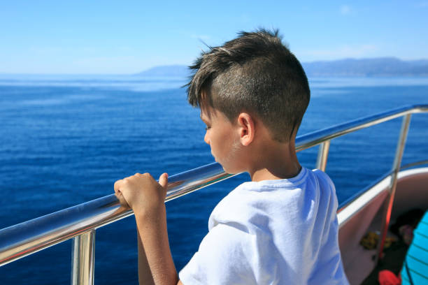 istock Boy in a deck of a cruise 826195448