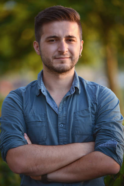 istock Portrait of smiling young man 826200404