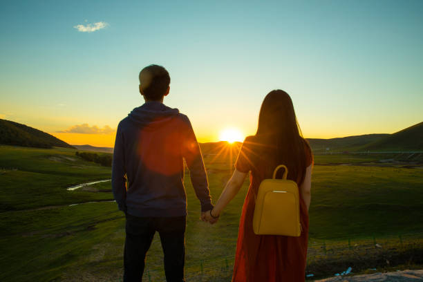 istock Loving couple looking at sunset 826200704