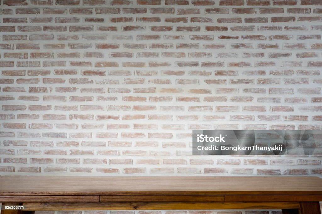 Mock up wooden table with white brick wall. Mock up wooden table with white brick wall. For product display montage. Mantelpiece Stock Photo