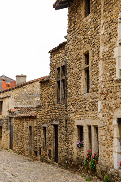 istock Old stone house in  Perouges, France, a medieval walled town, a popular touristic attraction. 826221060