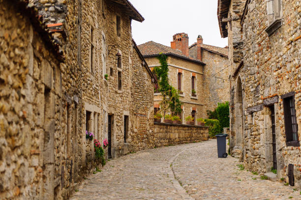 istock Narrow street in  Perouges, France, a medieval walled town, a popular touristic attraction. 826221094