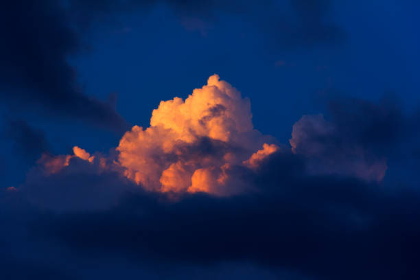 istock natural background of sky with clouds illuminated by the last sun rays at sunset 826232090