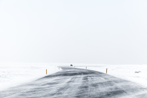 Icelandic road covered with snow, empty winter landscape. Iceland