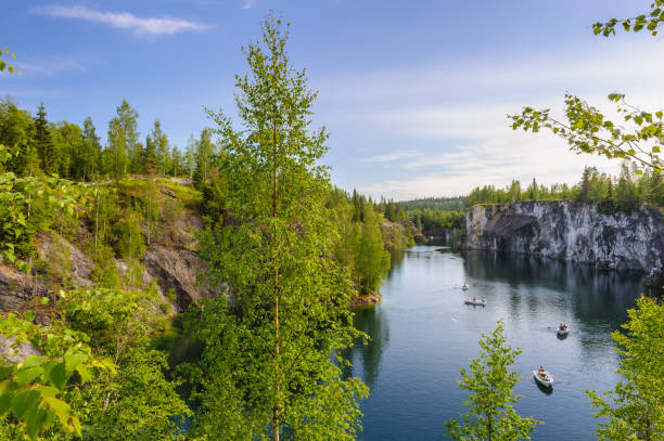 istock Panoramic view of river and fir trees on the rocks 826240238