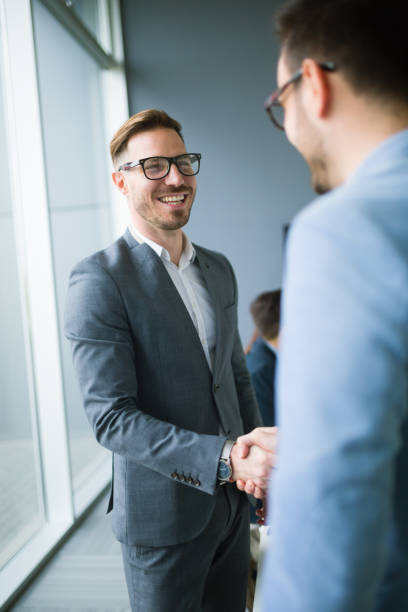 istock Business people shaking hands in modern office 826240366