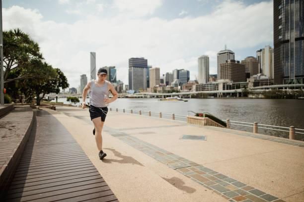 istock Young Man Jogging on Brisbane Southbank 826240590