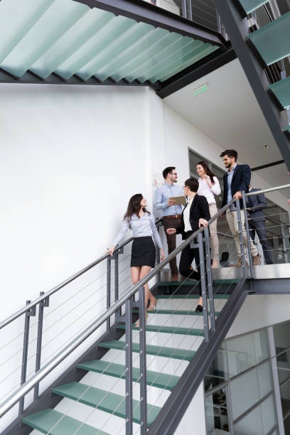 istock Business people having conversation at office building 826240594