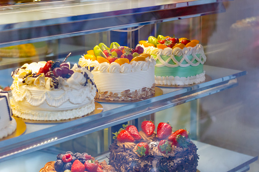 Beautifully decorated cakes on display at a bakery shop in London Chinatown