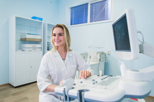 istock Ultrasound machine, doctor's hand usg investigation USCG 826244908