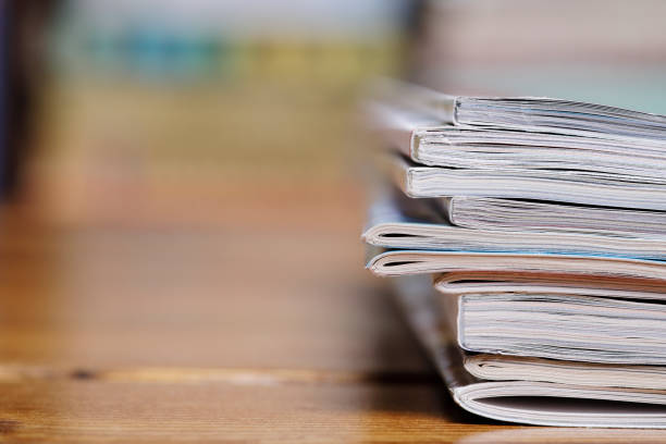 istock Stack of magazine extreme close up with copy space 826246032