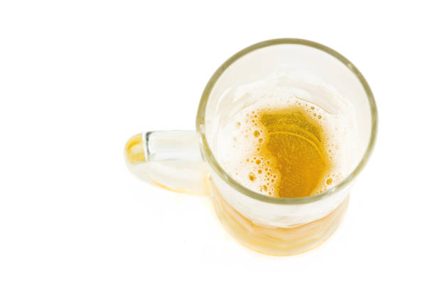 Ice Cold Mug Of Light Beer Isolated On White Background Closeup Shot From The Top