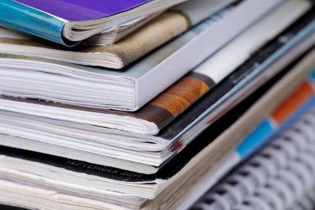 istock Stack of magazine extreme close up with copy space 826246484
