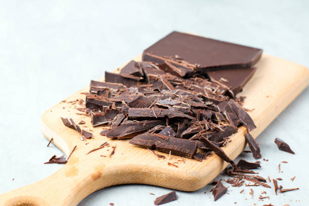 istock Chopped chocolate bar on cutting board as baking ingredient preparation 826248808