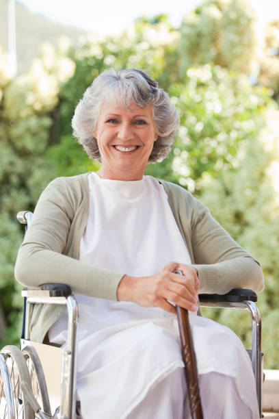 istock Retired woman with her walking stick 826251078