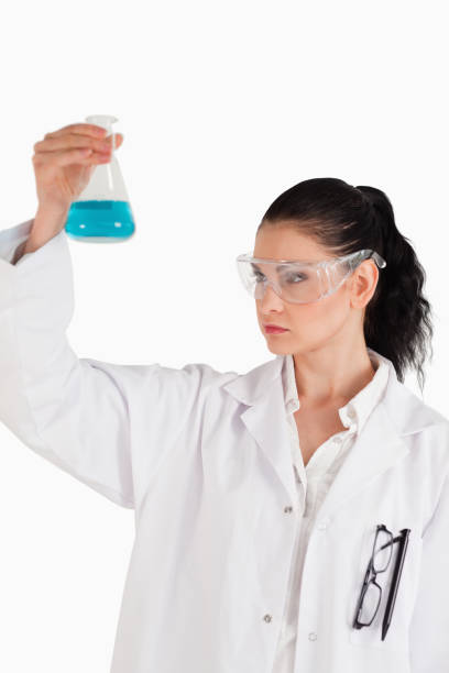 istock Darkhaired woman conducting an experiment 826251220