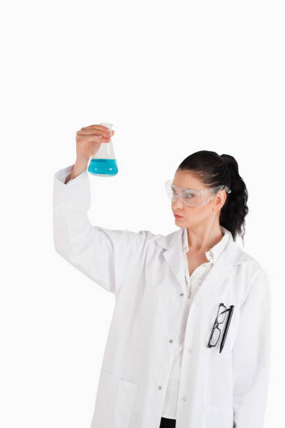 istock Darkhaired woman carrying out an experiment 826251280