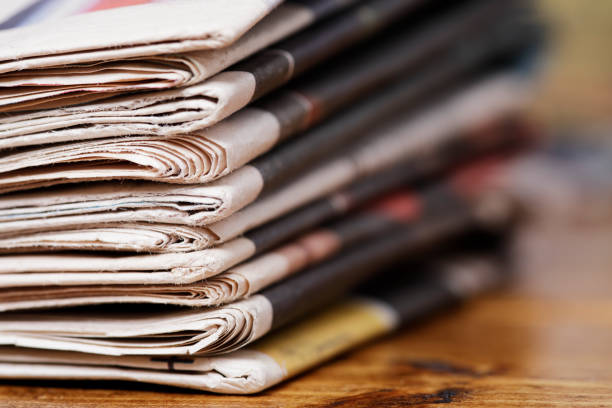 istock Stack of newspaper extreme close up with copy space 826251434