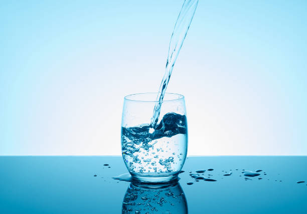 istock Creative splashing water in the glass 826255984