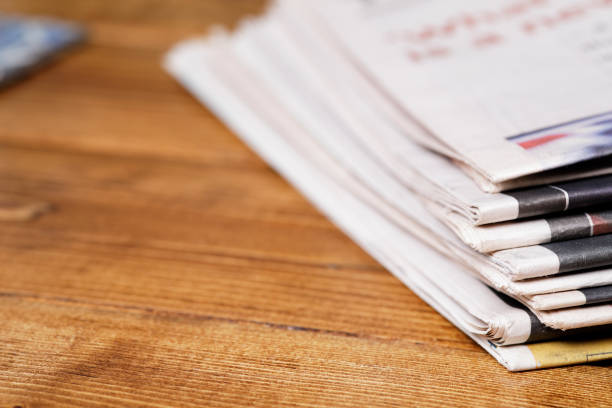 istock Stack of newspaper extreme close up with copy space 826256064