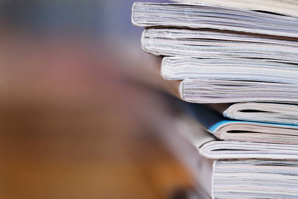 istock Stack of magazine extreme close up with copy space 826258470