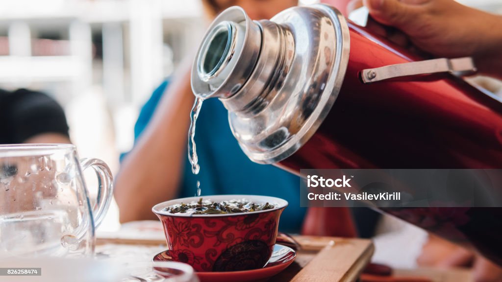 https://media.istockphoto.com/id/826258474/photo/thermos-at-the-tea-ceremony-close-up-brewing-tea-with-hot-water-from-a-thermos-bottle.jpg?s=1024x1024&w=is&k=20&c=W7yURy30b1n1EgT_BD_xJ8ajFdtw0hl8gheCKOUp2MU=