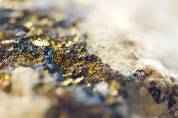 Golden  Abstract background from natural mineral. Macro