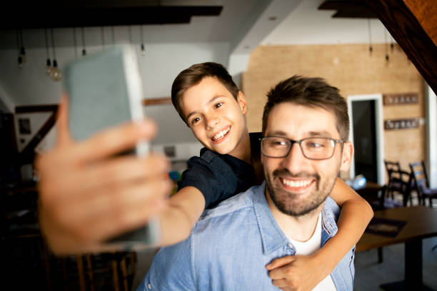 istock Father taking a selfie with his son 826260108