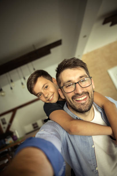 istock Father taking a selfie with his son 826260118
