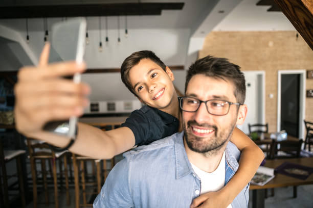 istock Father taking a selfie with his son 826260282