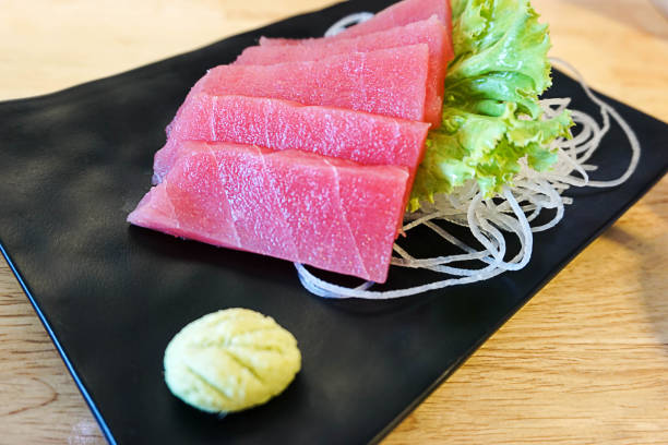 istock fresh tuna meat sashimi on a black ceramic dish 826267946