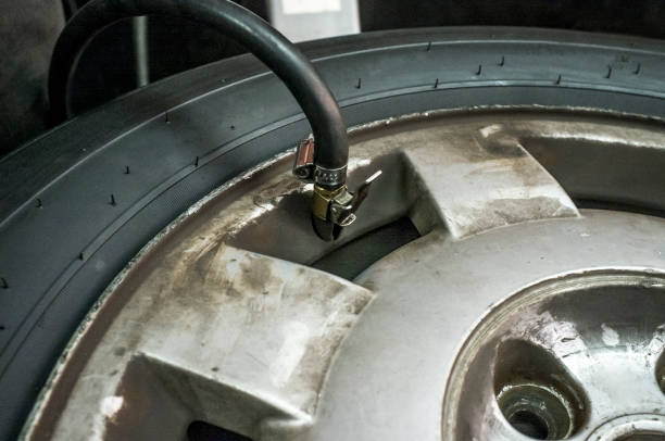 istock Inflating the tyre in the motor vehicle workshop 826272160
