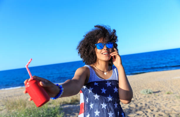 istock Woman with colorful sunglasses riding on sand 826273096