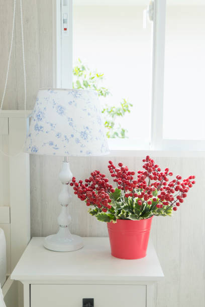Decorative red flower in white kid's bedroom interior