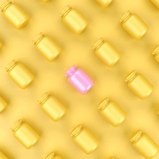 istock Pink Bottle Out Standing from Yellow Bottles on Yellow Background. 826285126