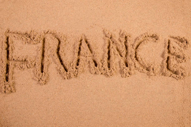 istock France written in soft wet sand on a beach 826287890