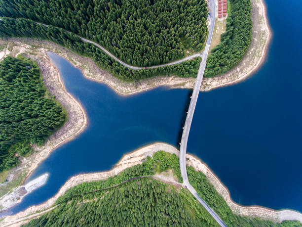 istock Road bridge over lake viewed from above aerial view 826289006