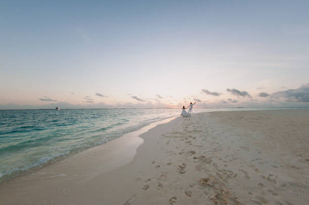 istock Wedding couple on the beach on the island 826289034