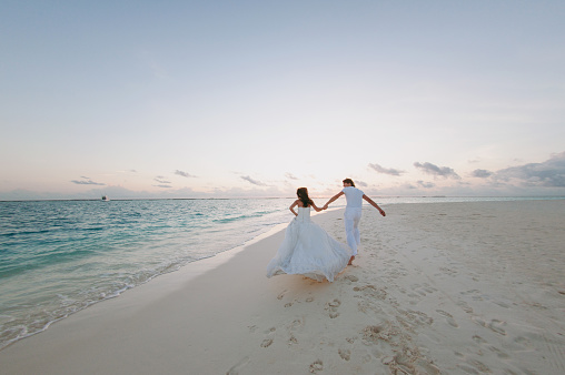 The wedding couple on the beach on the island