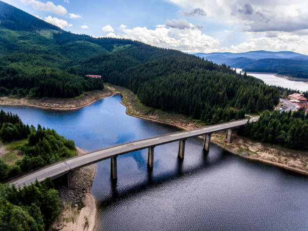 istock Bridge crossing lake aerial view 826289418