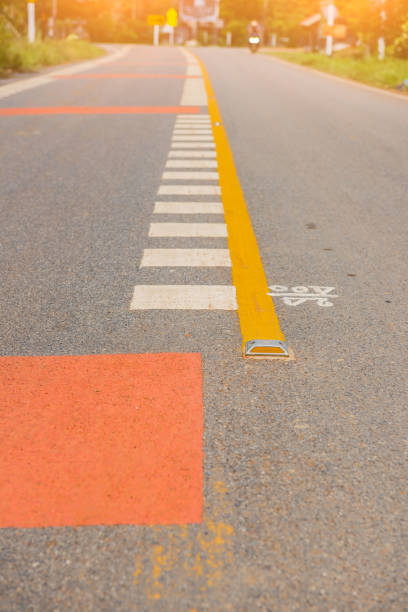 istock Asphalt road and Yellow divide lines on the highway 826301428